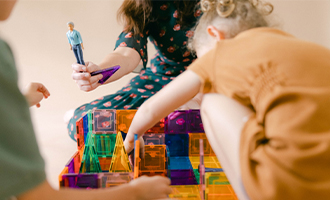 Angela playing with children